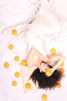 A young south american woman dreaming of fruits.