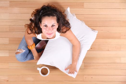 A young Girl drinking coffee.