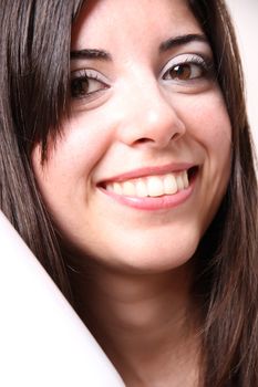 Portrait of a Hispanic young woman holding a cup of coffee.
