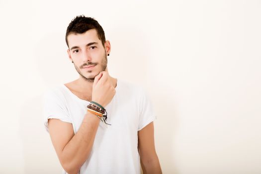 Portrait of a relaxed latin man in casual clothes.