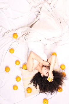 A young south american woman dreaming of fruits.