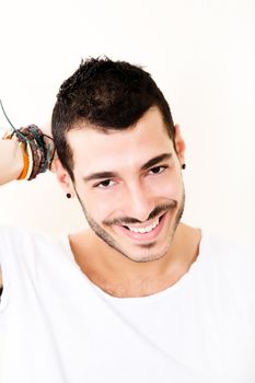 Portrait of a relaxed latin man in casual clothes.