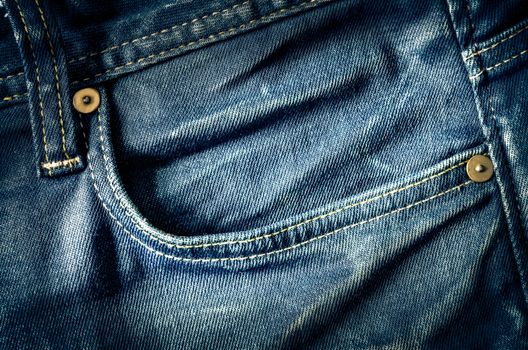 Detail of blue jeans pocket in old vintage style