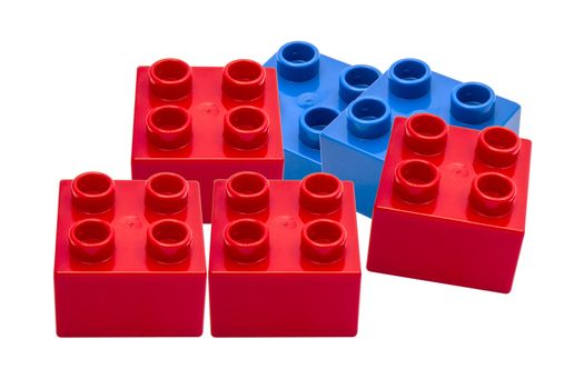 Colorful building blocks closeup on white background
