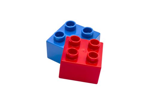 Colorful building blocks closeup on white background