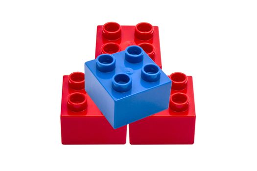 Colorful building blocks closeup on white background