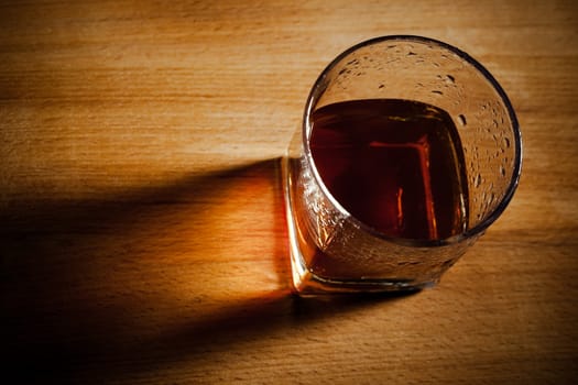 glass from whisky on a wooden table