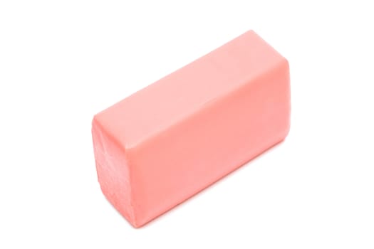 a piece of pink soap on a white background