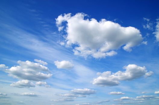 white fluffy clouds in the blue sky