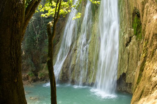 waterfall in deep green forest