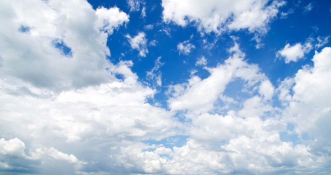 blue sky background with tiny clouds