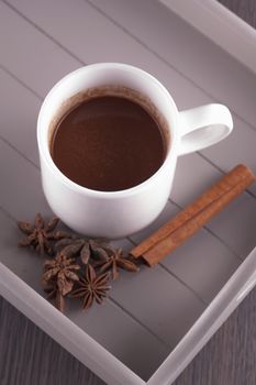 Hot chocolate cup with cinnamon and star anise