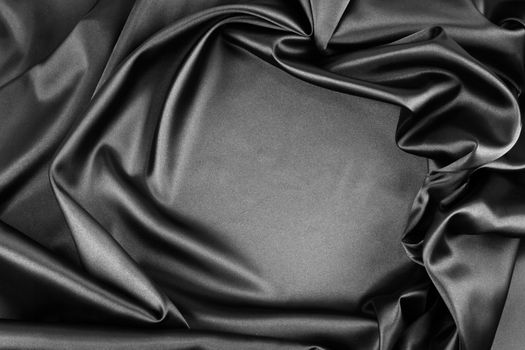 Closeup of rippled black silk fabric