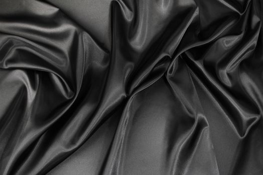 Closeup of rippled black silk fabric