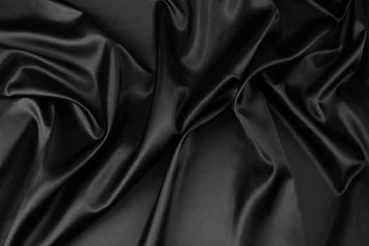 Closeup of rippled black silk fabric