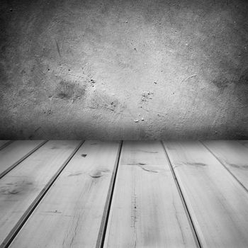 Wooden floorboards and concrete wall 