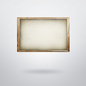 Blank canvas in frame on plain background