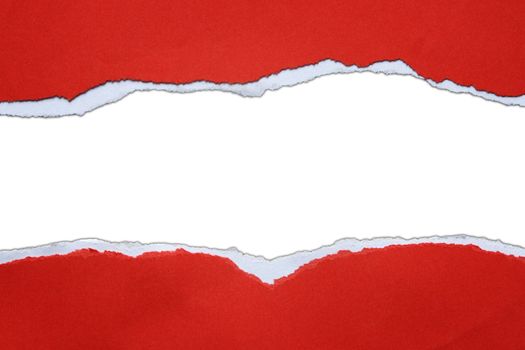 Hole ripped in red paper on white background
