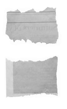 Two pieces of torn paper isolated on plain background