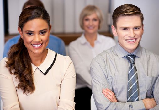 Businessmen and women attending a seminar