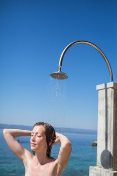 Pretty, young woman  under shower