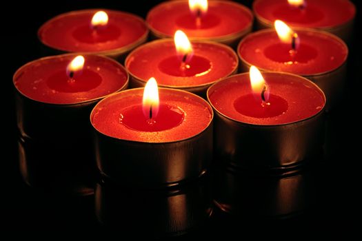 red candles on a black background