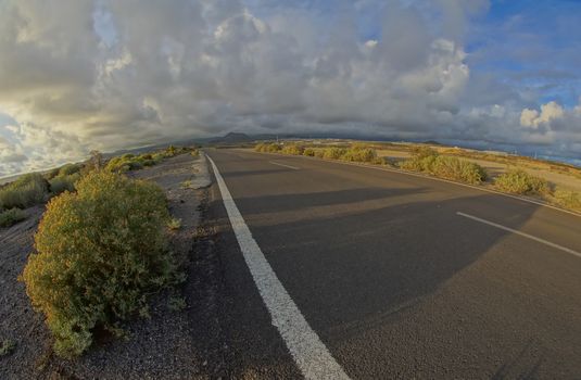 Long Empty Desert Road on a Cludy Day