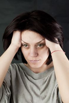 conceptual portrait of stressed abused young woman 