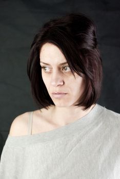 conceptual portrait of stressed abused young woman 