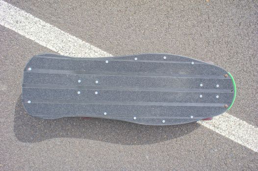 Hdr Picture Vintage Style Longboard Black Skateboard on an Empty Asphalt Desert Road