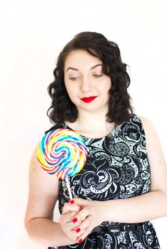 beautiful retro girls portrait with colorful lollipop