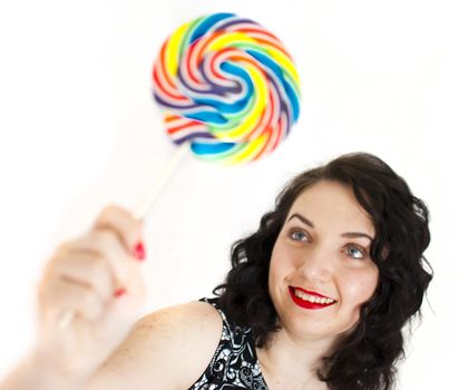 beautiful retro girls portrait with colorful lollipop