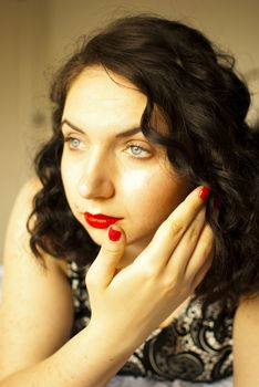 sansual retro girl portrait lying on a bed