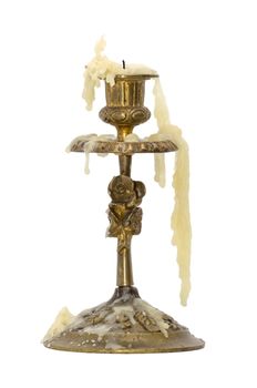 old vintage brass candlestick with a melted candle