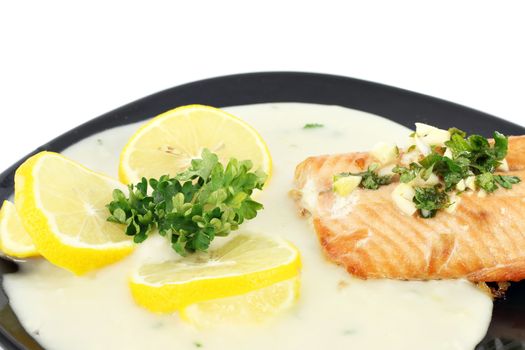 salmon with sauce and lemon