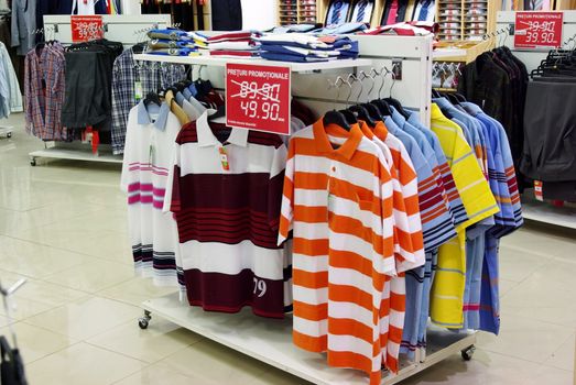 Summer clothes with discount in a shop.