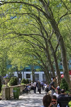 NEW YORK, USA - MAY 16: A late afternoon view of on Bryant Park on May 16 2013 in Manhattan. Bryant Park is a popular 9.6 acre park located adjacent to The NY Public Library.