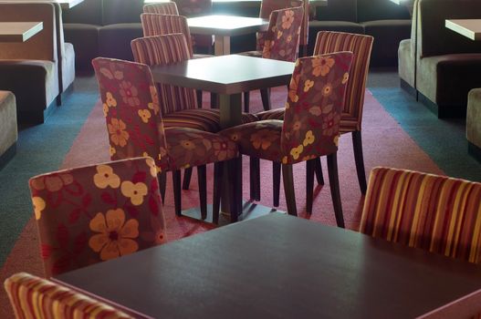 Shot of tables and chairs in billiard room