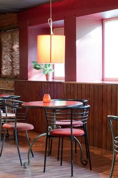 Shot of tables and chairs in billiard room