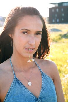 Outdoor shot of beautiful brunette woman with long hair