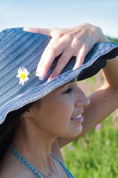 Outdoor shot of beautiful brunette woman with long hair