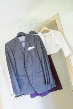 Jacket and other clothes hanging on the door