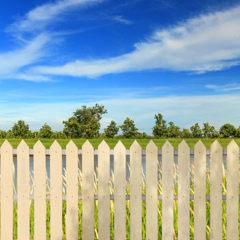 White fences with blue sky