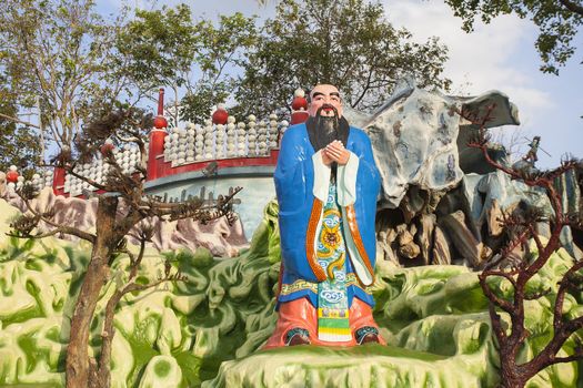 SINGAPORE - FEBRUARY 1, 2014: Chinese Scholar and Teacher Confucius Statue Diorama at Haw Par Villa Theme Park. This theme park contains over 1,000 statues and 150 giant dioramas depicting scenes from Chinese mythology, folklore, legends, and history.