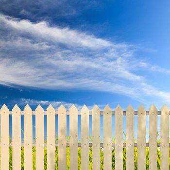 White fences with blue sky