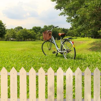 White fences in the garden with bicycles