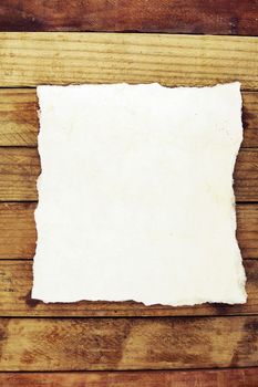 Piece of torn paper on boards