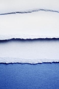 Closeup of ripped blue paper