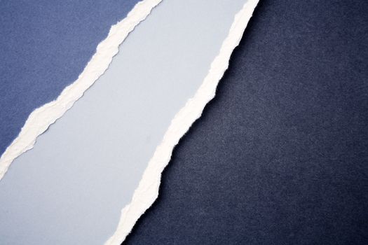 Closeup of ripped blue paper