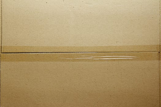 Closeup of packing tape on cardboard box 